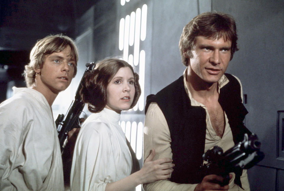 American actors Mark Hamill, Carrie Fisher and Harrison Ford on the set of Star Wars: Episode IV - A New Hope written, directed and produced by Georges Lucas. (Photo by Sunset Boulevard/Corbis via Getty Images)