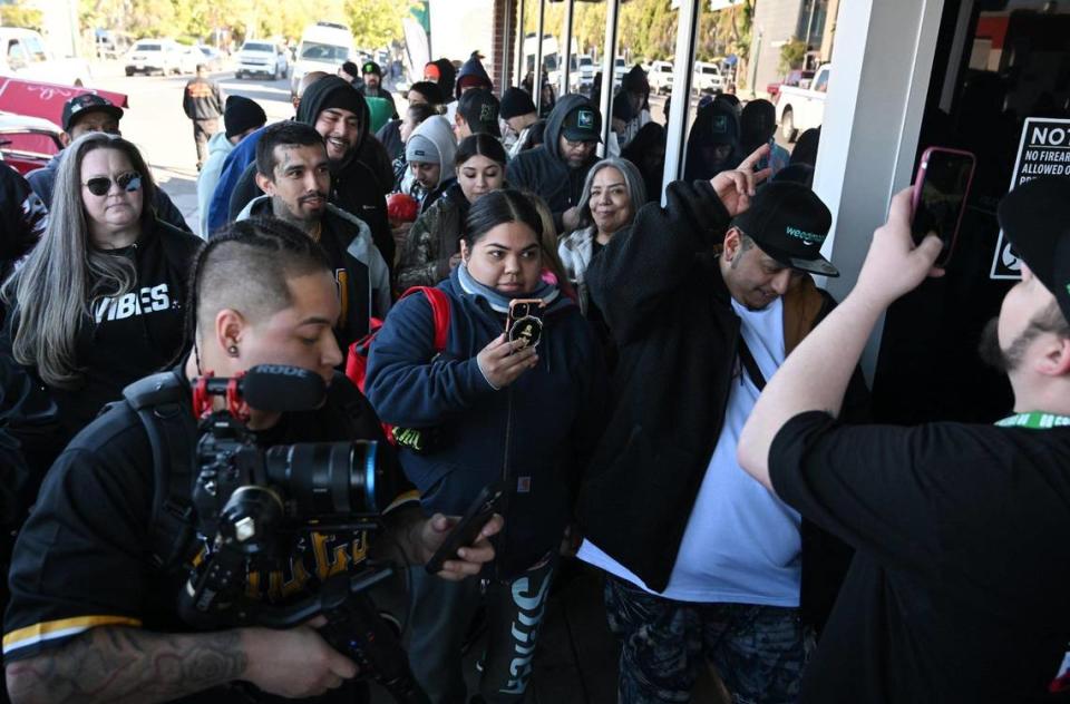 A crowd gathers for the grand opening of Dr. Greenthumbs, Fresno newest cannabis dispensary, Saturday morning, April 6, 2024 in Fresno.