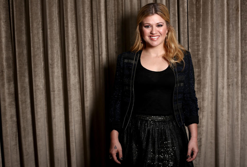 In this Monday, Nov. 5, 2012 photo, musician Kelly Clarkson poses for a portrait in Los Angeles. Clarkson's newest album, Greatest Hits: Chapter One," is releasing on Monday, Nov. 19, 2012. (Photo by Matt Sayles/Invision/AP)