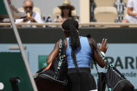 Coco Gauff of the U.S. leaves after losing her quarterfinal match of the French Open tennis tournament against Poland's Iga Swiatek at the Roland Garros stadium in Paris, Wednesday, June 7, 2023. (AP Photo/Christophe Ena)