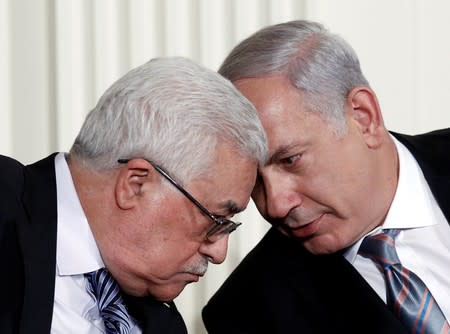 FILE PHOTO: Israeli Prime Minister Benjamin Netanyahu and Palestinian President Mahmoud Abbas speak during an event about the Middle East peace talks at the White House