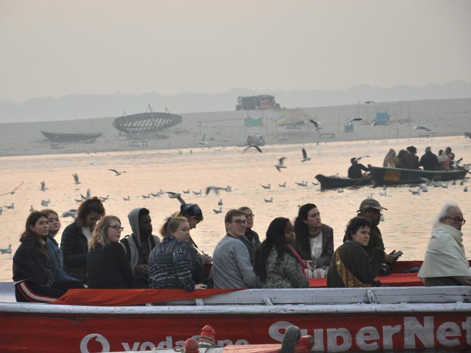 Tourists take a boat ride on foggy winter morning by the River Ganga, at Pandaye Ghat, on December 17, 2018 in Varanasi, India.