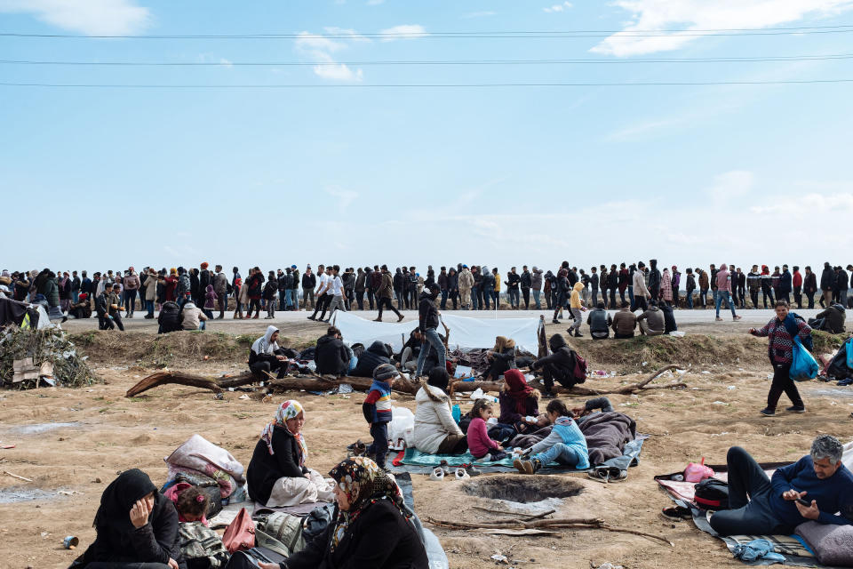 Thousands of migrants wait near the Pazarkule border crossing. | Emin Ozmen—Magnum Photos for TIME