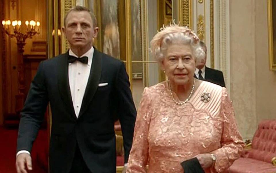 The Queen alongside Daniel Craig in 2012 - GETTY IMAGES