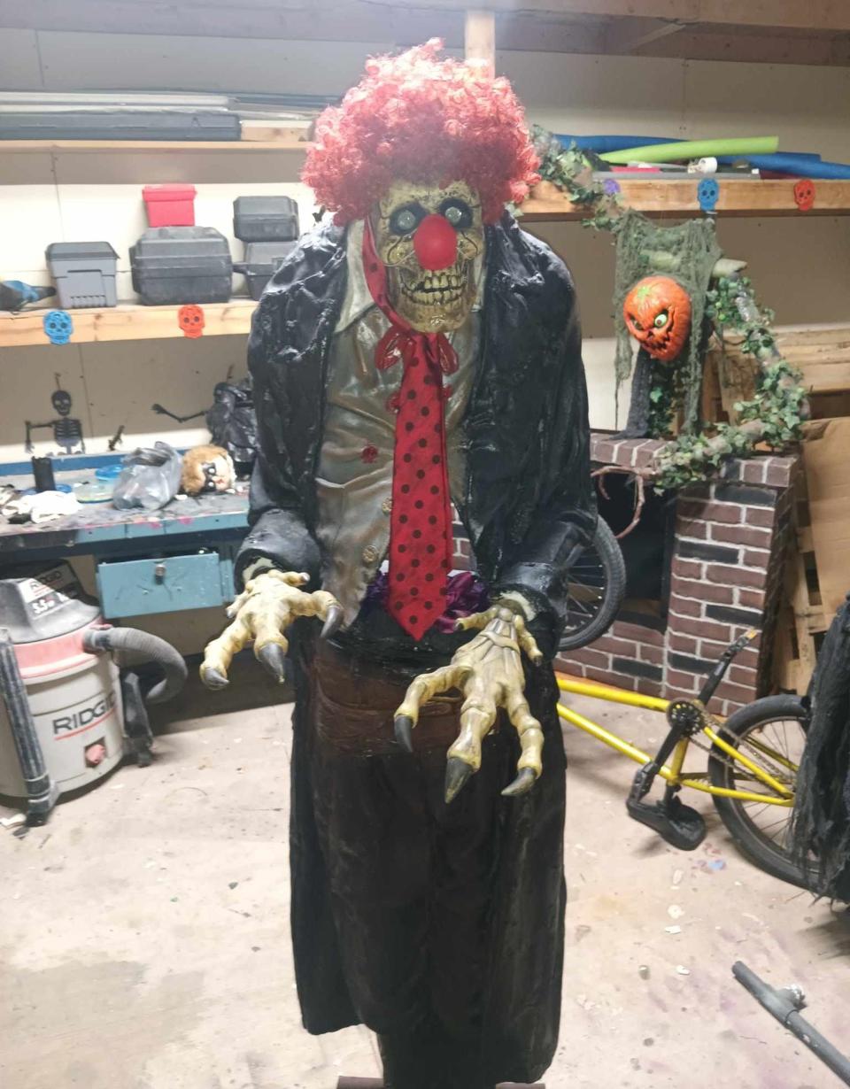 Kody Clark of Monroe created this clown statue with dinosaur claws and a skeleton face. The life-size prop was recently used at a local haunted attraction.