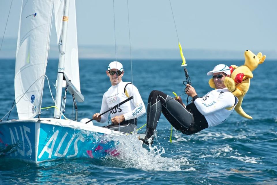 World 470 dinghy champion Malcolm Page of Australia (right) practising with a toy kangaroo called "Skip” on his shoulders at the Olympic sailing venue in Weymouth