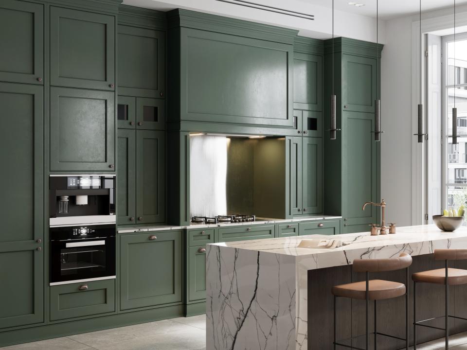 Green cabinets and stone countertop in kitchen