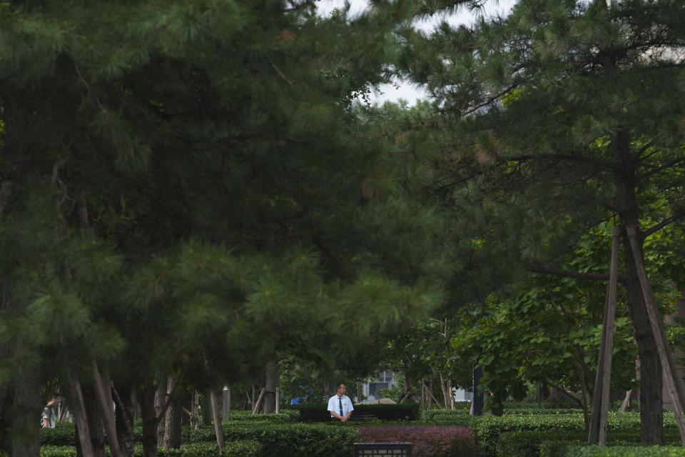 A security stands guard at the central business district in Beijing, China, Monday, July 15, 2024. China's ruling Communist Party is starting a four-day meeting Monday that is expected to lay out a strategy for self-sufficient economic growth in an era of heightened national security concerns and restrictions on access to American technology. (AP Photo/Vincent Thian)