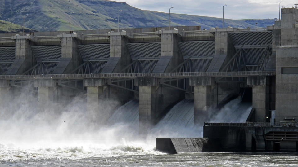 FILE - In this April 11, 2018 file photo, water moves through a spillway of the Lower Granite Dam on the Snake River near Almota, Wash. Farmers, environmentalists, tribal leaders and public utility officials are eagerly awaiting a federal report due Friday, Feb. 28, 2020, that could decide the fate of four hydroelectric dams on the Snake River. (AP Photo/Nicholas K. Geranios,File)