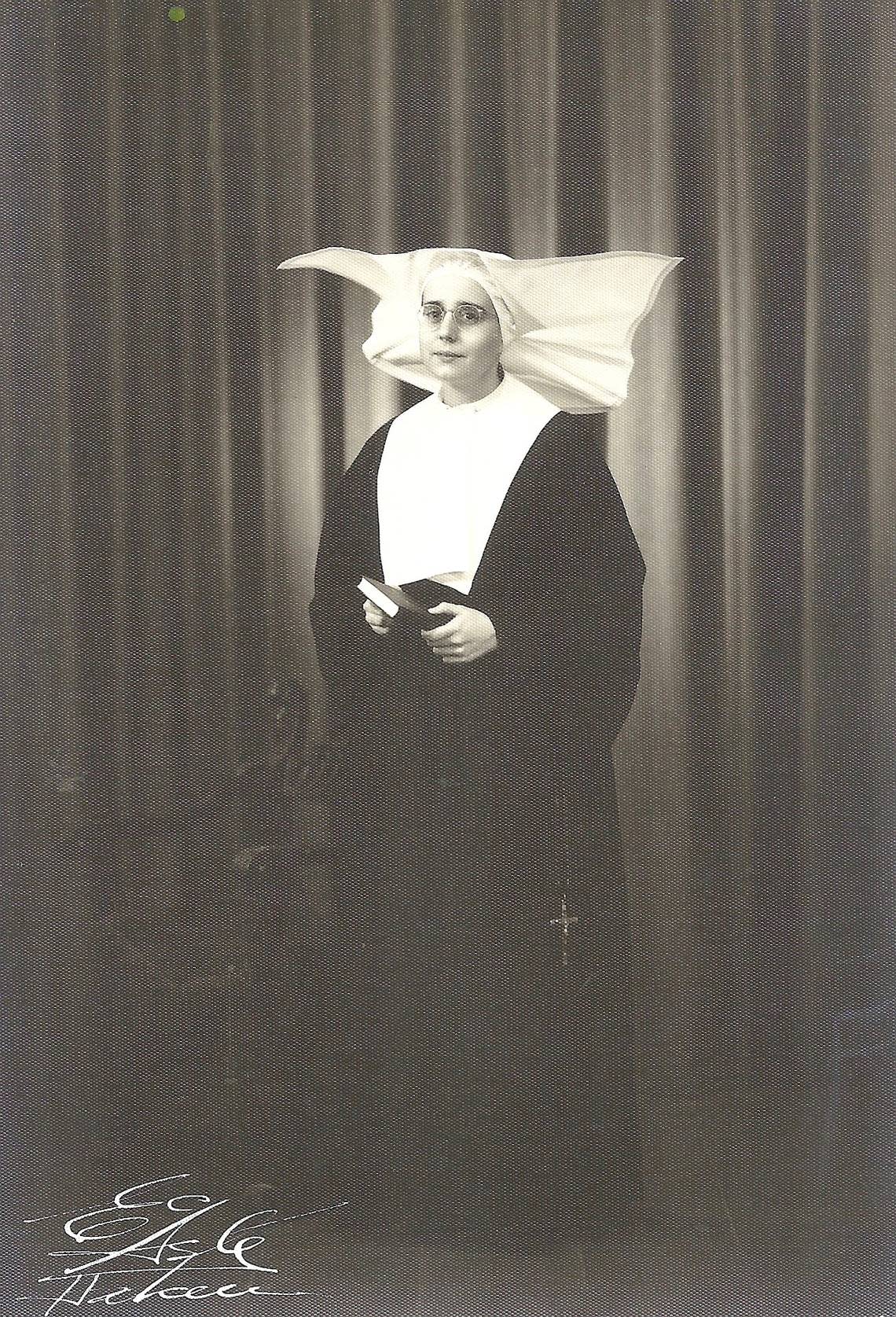 Sister Hilda Alonso taking her first vows in 1951. The Daughters of Charity wore exuberant headdresses of starched flaps to cover their heads.