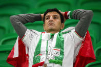 Iran's soccer team fan looks on at the end of the World Cup group B soccer match between Iran and the United States at the Al Thumama Stadium in Doha, Qatar, Wednesday, Nov. 30, 2022. (AP Photo/Ebrahim Noroozi)