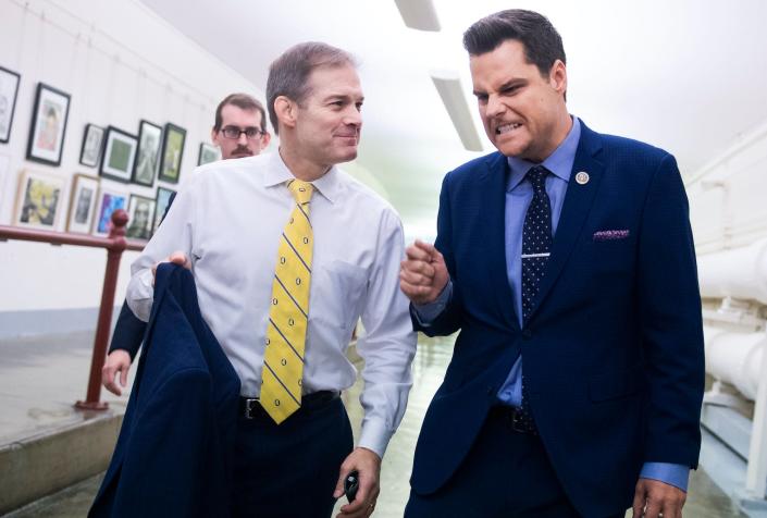 Reps. Jim Jordan, R-Ohio, left, and Matt Gaetz, R-Fla., make their way to a vote in the Capitol on Friday, November 15, 2019.