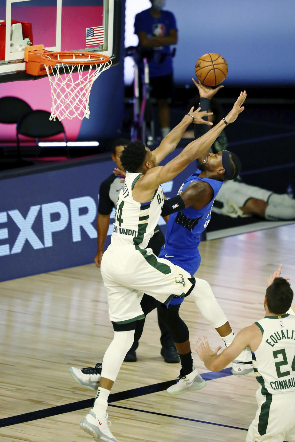 Orlando Magic guard Terrence Ross (31) shoots over Milwaukee Bucks forward Giannis Antetokounmpo (34) during the first half of Game 1 of an NBA basketball first-round playoff series, Tuesday, Aug. 18, 2020, in Lake Buena Vista, Fla. (Kim Klement/Pool Photo via AP)