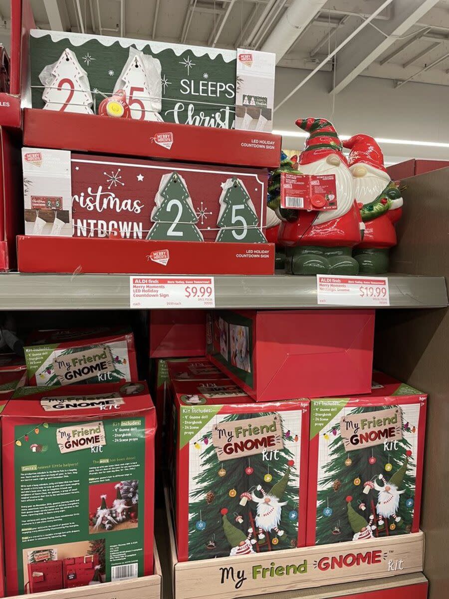 Two top rows of gnome christmas decorations at Aldi, Arcadia, California, clean light grey ceiling in the top background