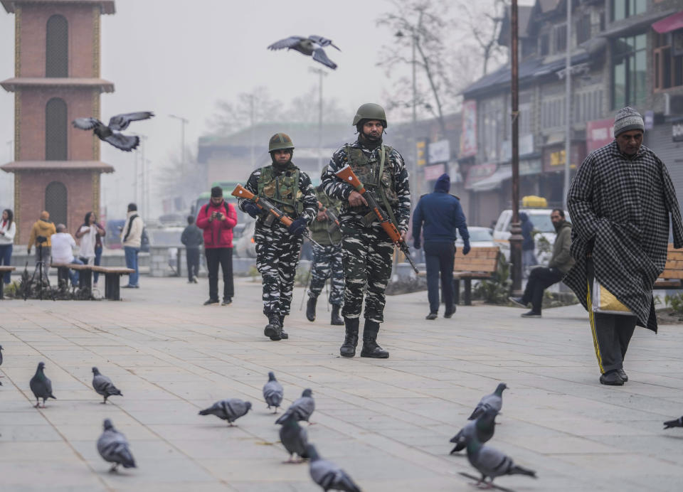 Indian paramilitary soldiers patrol at the main market in Srinagar, Indian controlled Kashmir, Monday, Dec. 11, 2023. India’s top court on Monday upheld a 2019 decision by Prime Minister Narendra Modi’s government to strip disputed Jammu and Kashmir’s special status as a semi-autonomous region with a separate constitution and inherited protections on land and jobs. (AP Photo/Mukhtar Khan)