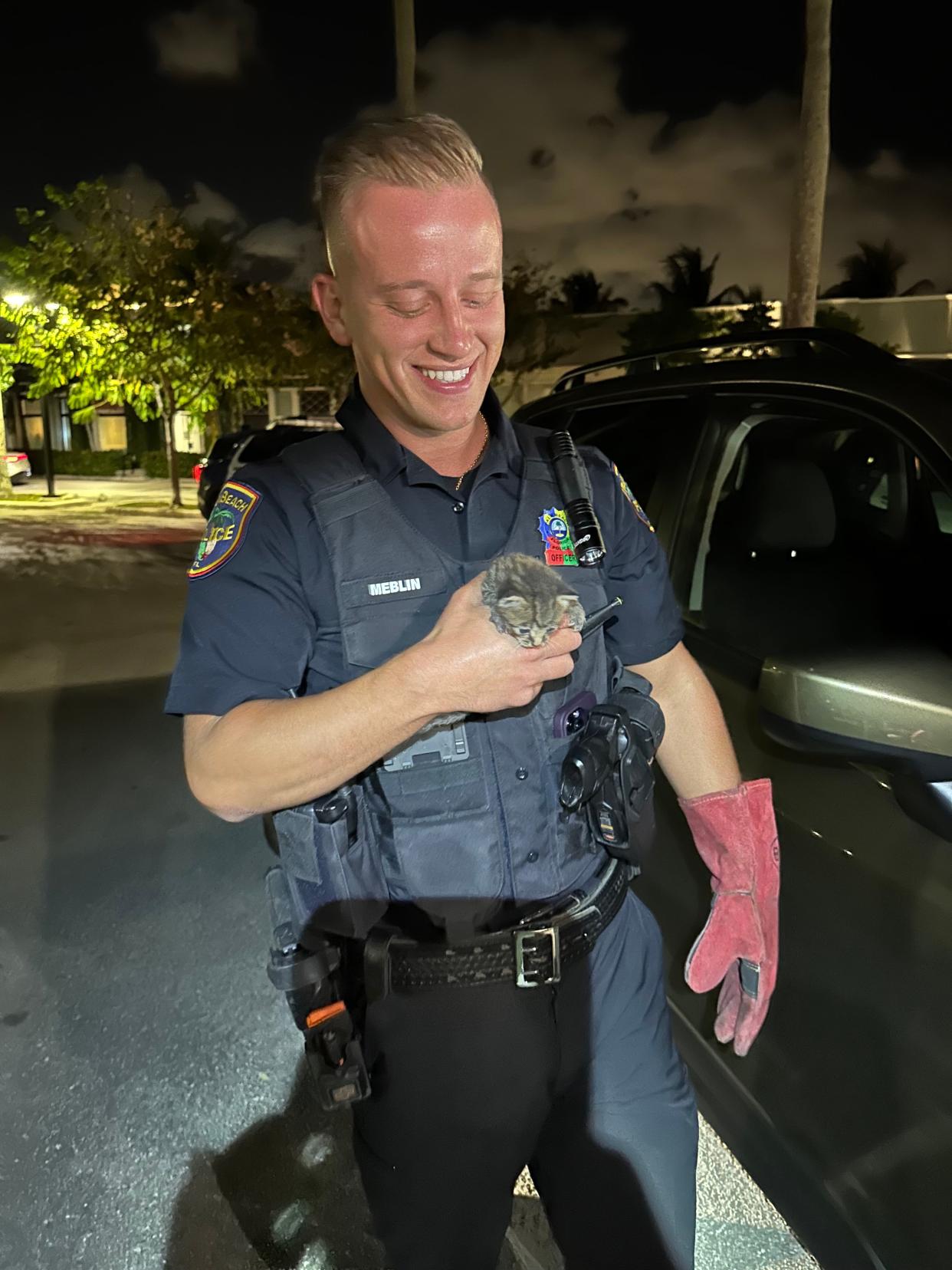 Officer Dan Meblin with Officer Dan, the kitten he helped to rescue.