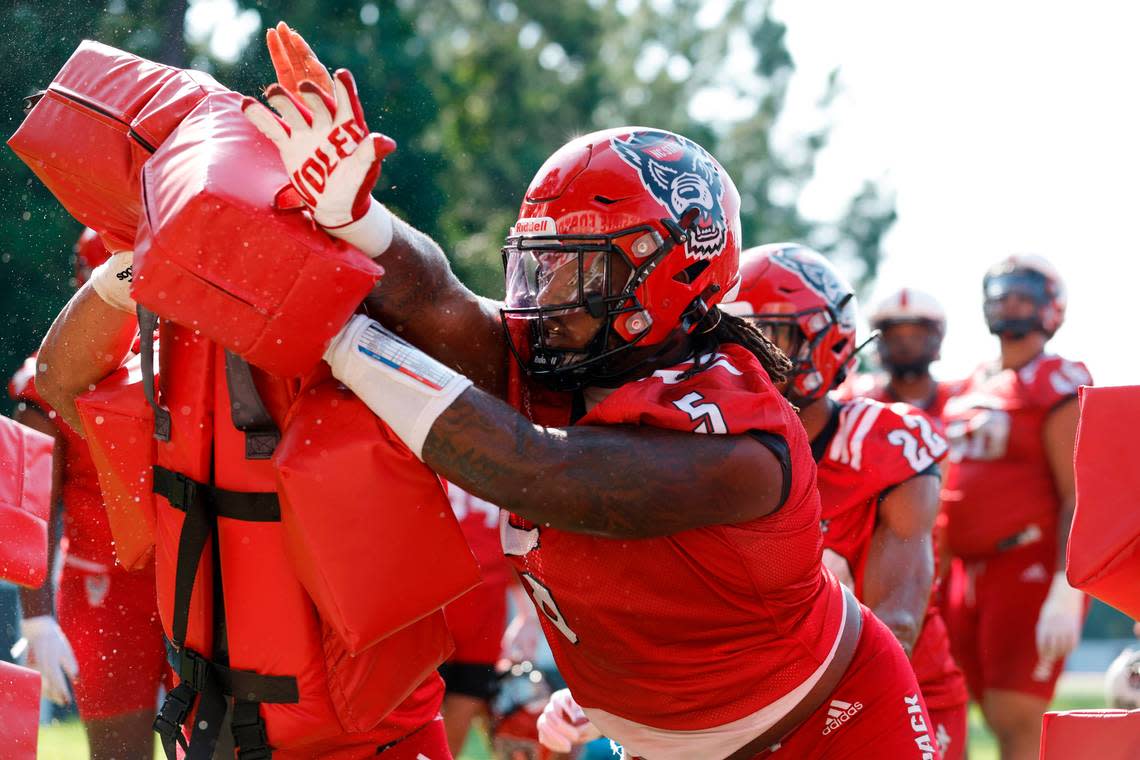 N.C. State defensive tackle C.J. Clark (5) runs drills during the Wolfpack’s first practice of fall camp in Raleigh, N.C., Wednesday, August 3, 2022.