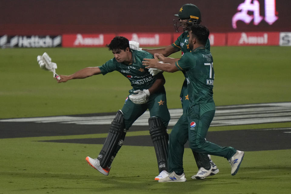 Pakistan's Naseem Shah, left, and teammates celebrate their win in the T20 cricket match of Asia Cup against Afghanistan, in Sharjah, United Arab Emirates, Wednesday, Sept. 7, 2022. (AP Photo/Anjum Naveed)