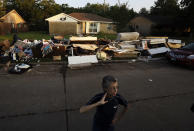 <p>Joan Finmore looks out as she takes a break from sorting items at a friend’s flooded home Saturday, Sept. 2, 2017, in Houston, Texas. (Photo: Gregory Bull/AP) </p>