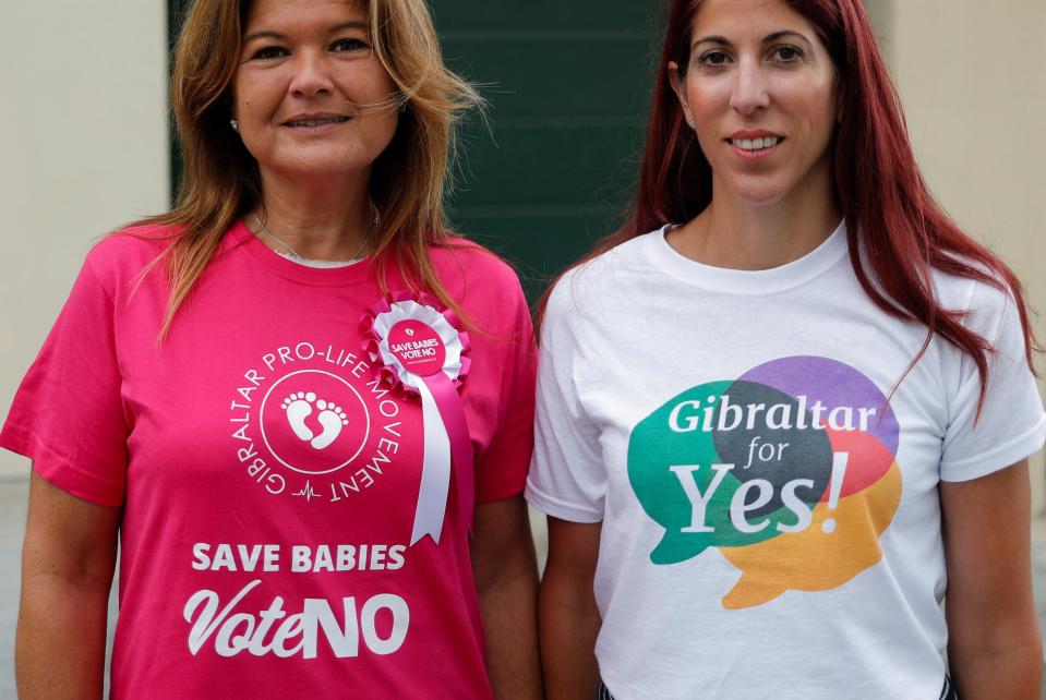 Gibraltarian women from both sides of the campaign outside a polling station on Thursday (REUTERS)