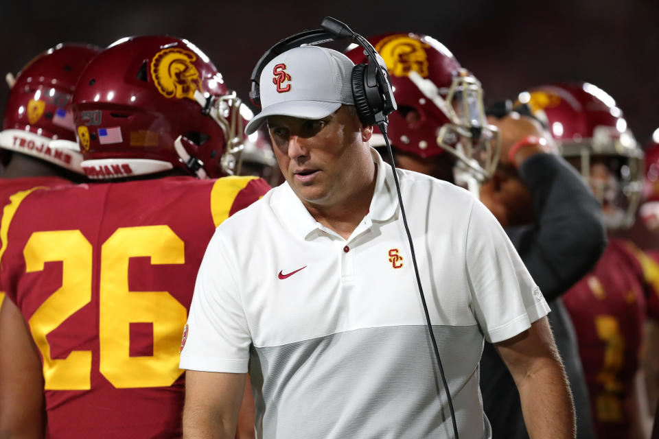 Clay Helton of the USC Trojans looks on from the sidelines during a game. (Getty)