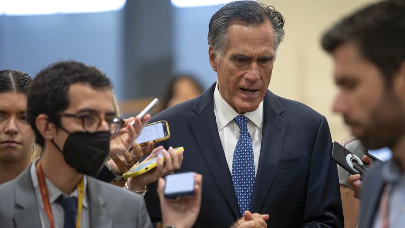 Sen. Mitt Romney, R-Utah, speaks to reporters as he arrives for a vote on Capitol Hill, Tuesday, Sept. 12, 2023, in Washington.