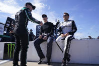 Justin Haley, left, talks with Brad Keselowski, center, and Landon Cassill, right, prior to practice and qualifying at Richmond Raceway for Sunday's NASCAR Cup Series auto race Saturday, Aug. 13, 2022, in Richmond, Va. (AP Photo/Steve Helber)