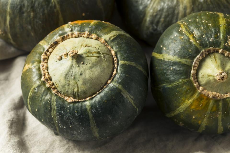 raw organic buttercup squash ready to cut