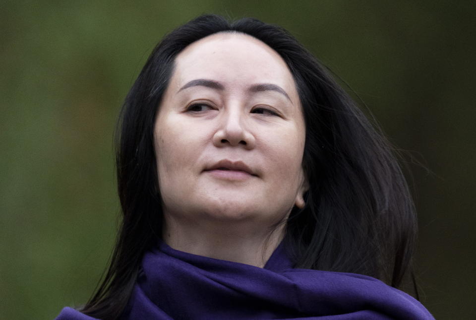 Chief Financial Officer of Huawei, Meng Wanzhou leaves her home in Vancouver, British Columbia, Wednesday, Oct. 28, 2020. Wanzhou is heading to the British Columbia Supreme Court in an evidentiary hearing on her extradition case. (Jonathan Hayward/The Canadian Press via AP)