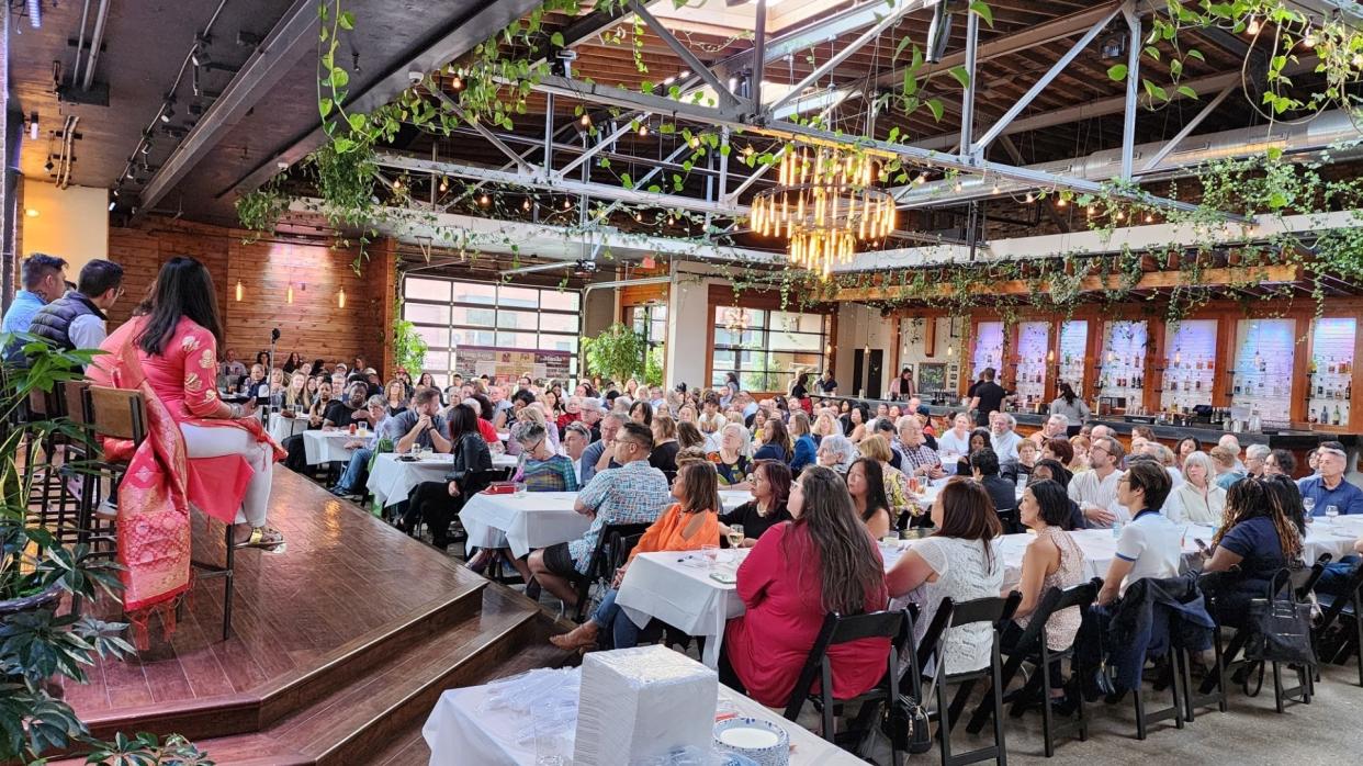 A crowd enjoys a performance at the Lubar Center's Asian Heritage Dinner.