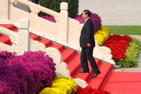Chinese President Xi arrives at a wreath laying ceremony at the Monument to the People's Heroes in Tiananmen Square in Beijing