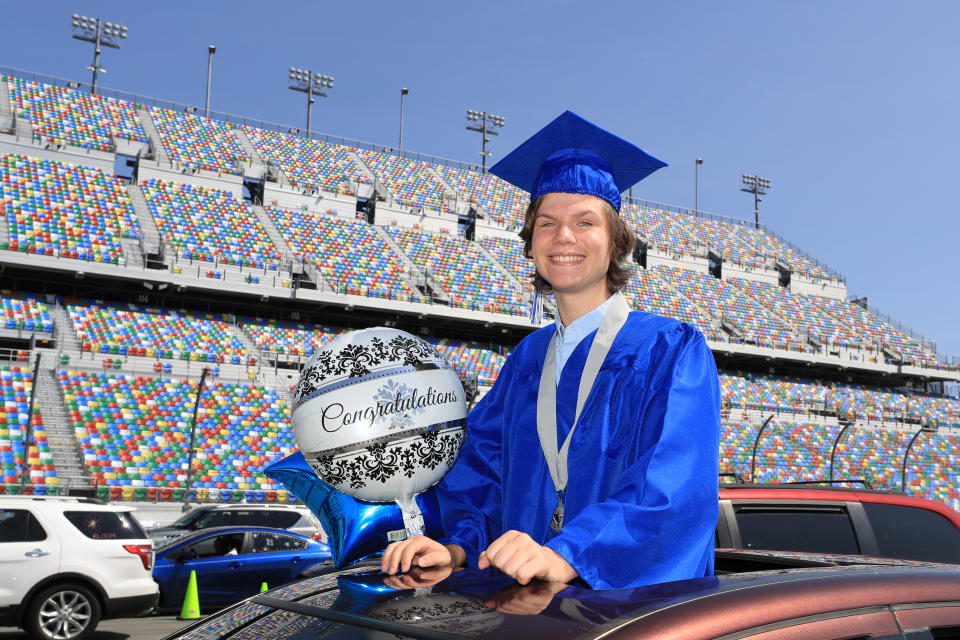 DAYTONA BEACH, FLORIDA - MAY 31:  Graduates of Matanzas High School receive their diplomas on the track in their cars at Daytona International Speedway on May 31, 2020 in Daytona Beach, Florida. (Photo by Sam Greenwood/Getty Images)