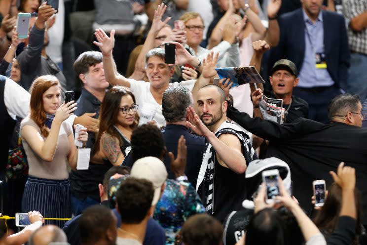 Manu Ginobili waves to Spurs fans as he leaves the court for perhaps the last time. (Getty Images)