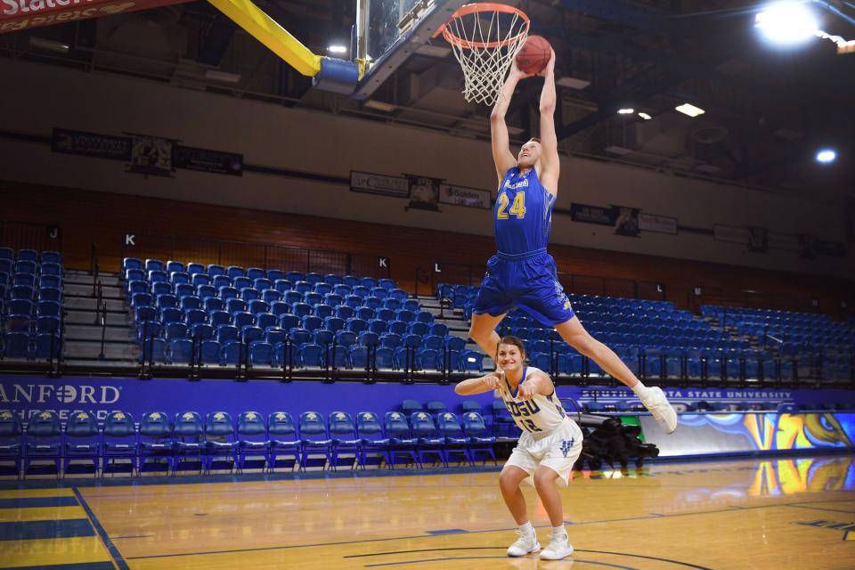 SDSU's Mike Daum dunks over Macy Miller Tuesday, Feb. 19, in Brookings.