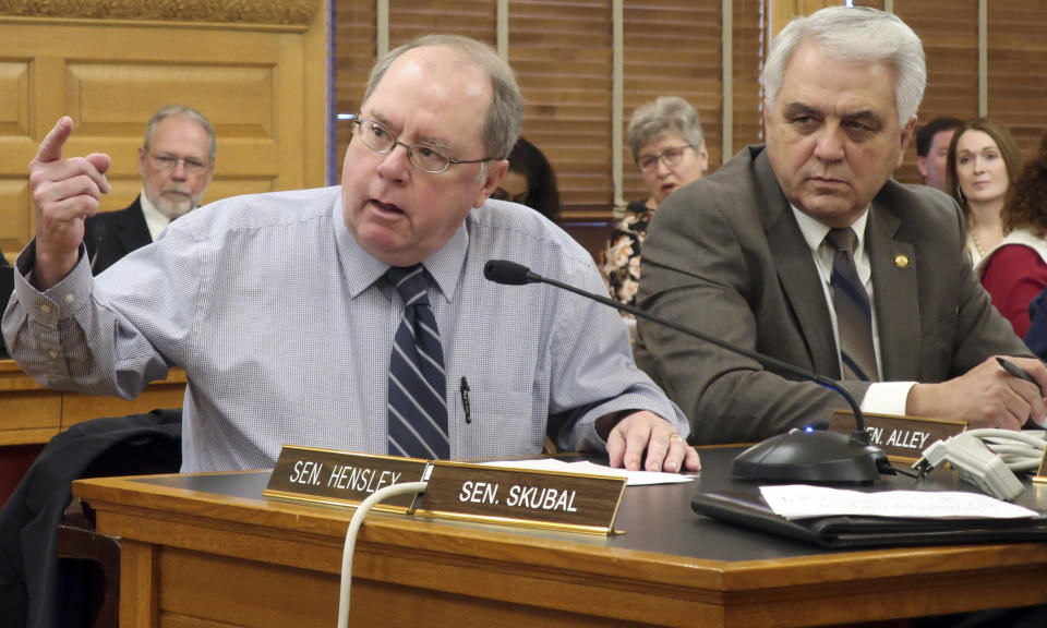 Kansas Senate Minority Leader Anthony Hensley, D-Topeka, makes a point during a briefing on Democratic Gov. Laura Kelly's budget proposals as Sen. Larry Alley, R-Winfield, watches, Thursday, Jan. 17, 2019, at the Statehouse in Topeka, Kan. Democrats are pleased by the governor's proposals to expand the state's Medicaid program and increase spending on public schools. (AP Photo/John Hanna)