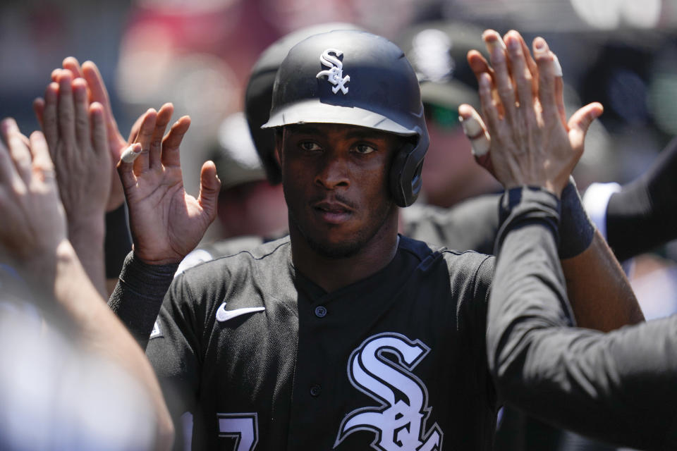 Chicago White Sox's Tim Anderson (7) celebrates in the dugout after scoring off of a single hit by Eloy Jimenez during the third inning of a baseball game against the Los Angeles Angels in Anaheim, Calif., Thursday, June 29, 2023. Zach Remillard also scored. (AP Photo/Ashley Landis)