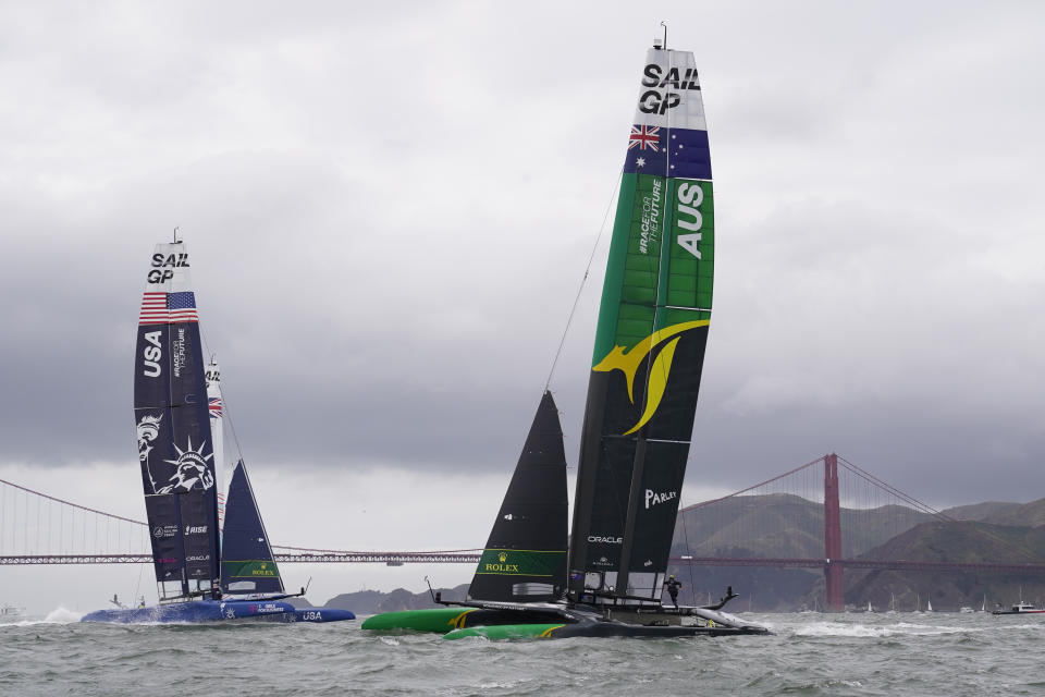 Australia's, right, and United States' SailGP catamarans round a mark during a fleet race of the Mubadala United States Sail Grand Prix, Sunday, March 27, 2022, in San Francisco. (AP Photo/Eric Risberg)