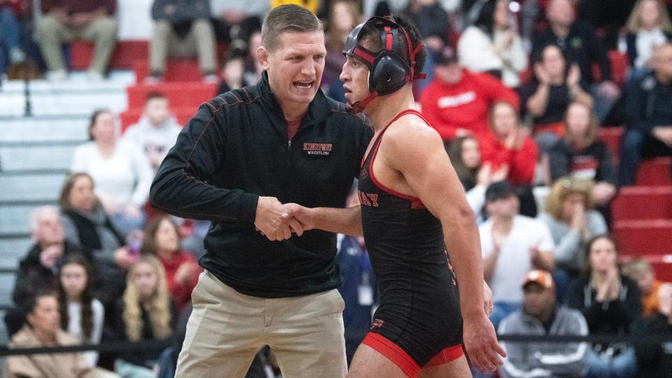 Kingsway's head coach Mike Barikian congratulates Kingsway's Ramon Alfonso-Arroyo after Alfonso-Arroyo defeated Washington Township's Aiden Hardy, 14-6, during the 132 lb. bout of the wrestling meet held at Washington Township High School on Monday, February 5, 2024.