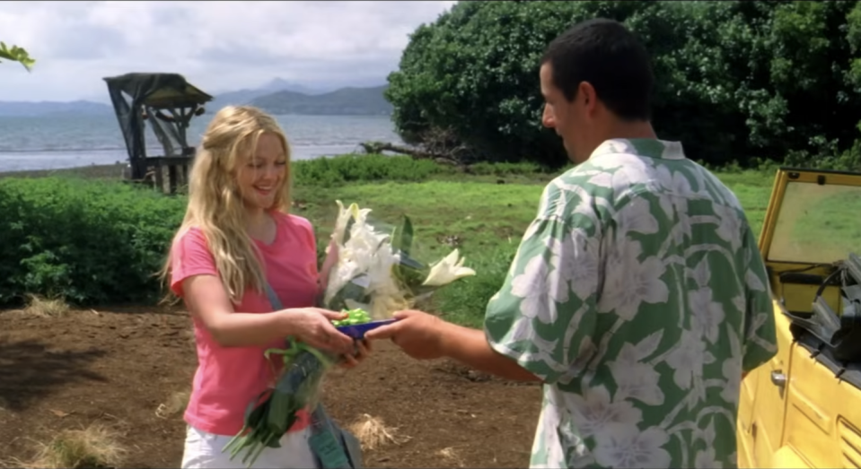 a man and a woman holding a bird