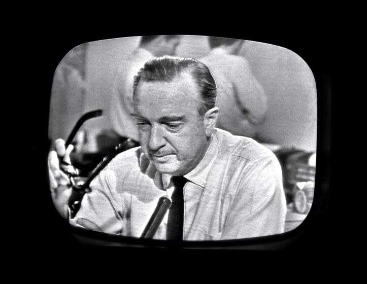 Screen capture of American broadcast journalist Walter Cronkite as he removes his glasses while announcing the death of President John F Kennedy as seen from a television monitor, November 22, 1963. (Photo by CBS Photo Archive/Getty Images)