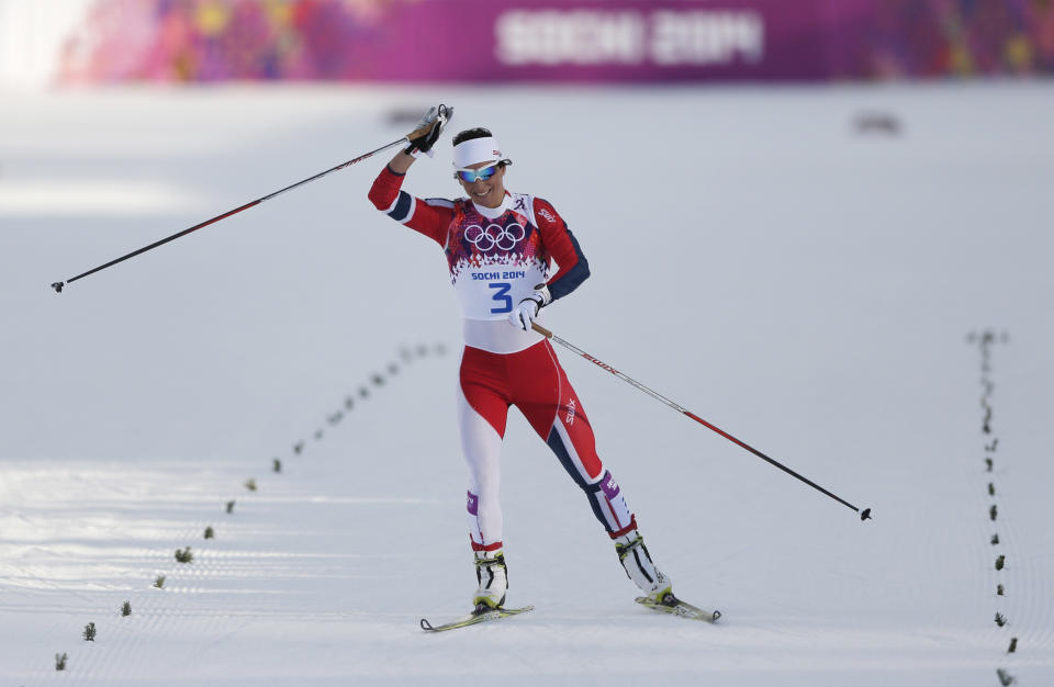 Norway's Marit Bjoergen skis toward the finish after falling during her women's semifinal heat of the cross-country sprint at the 2014 Winter Olympics, Tuesday, Feb. 11, 2014, in Krasnaya Polyana, Russia. (AP Photo/Matthias Schrader)