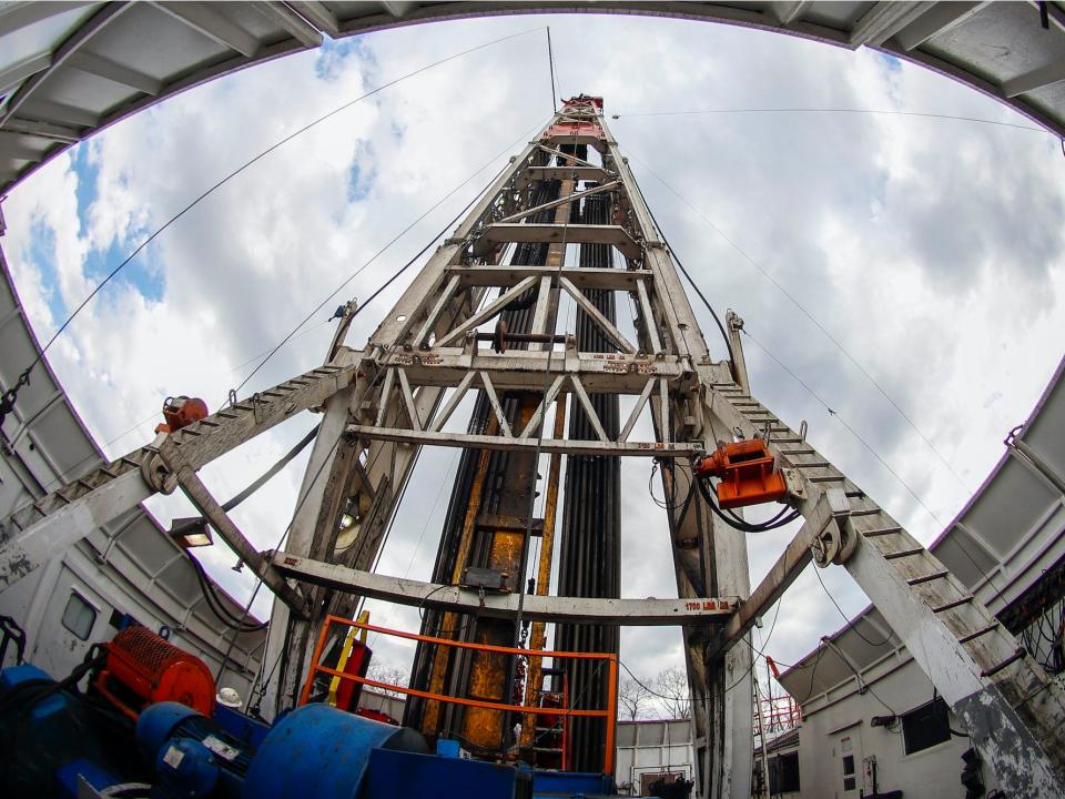 Thursday, March 12, 2020, workers change the equipment on the drilling platform at a Seneca Resources shale gas well drilling site in St. Mary's, Pa.