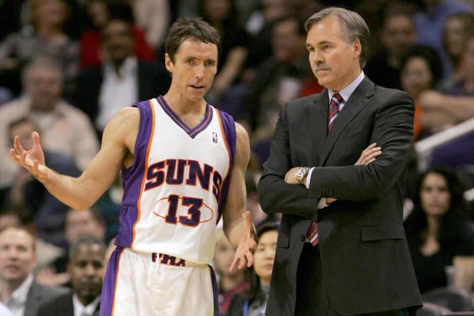 In this Feb. 6, 2008, file photo, Phoenix Suns guard Steve Nash talks with head coach Mike D'Antoni.