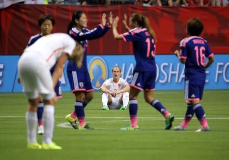 Netherlands defender Desiree Van Lunteren (center) reacts after losing to Japan in the round of sixteen in Vancouver, June 23, 2015. Japan won 2-1. Mandatory Credit: Matt Kryger-USA TODAY Sports