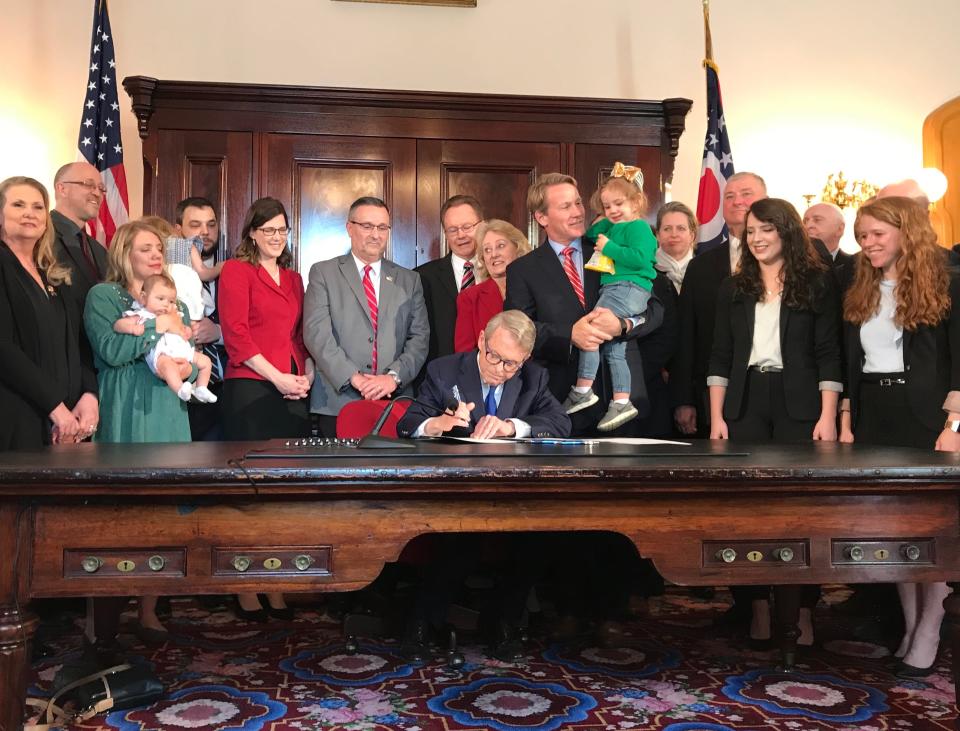 Ohio Gov. Mike DeWine signed the "heartbeat" bill,  which bans abortion after a fetal heartbeat is detected, on April 11, 2019 at the Ohio Statehouse.