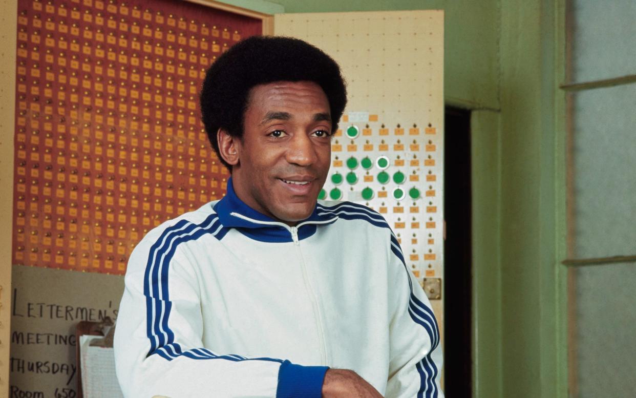 Bill Cosby posing with baseball equipment in this publicity photo for his television show, The Bill Cosby Show, which ran from 1969-71 - Bettmann