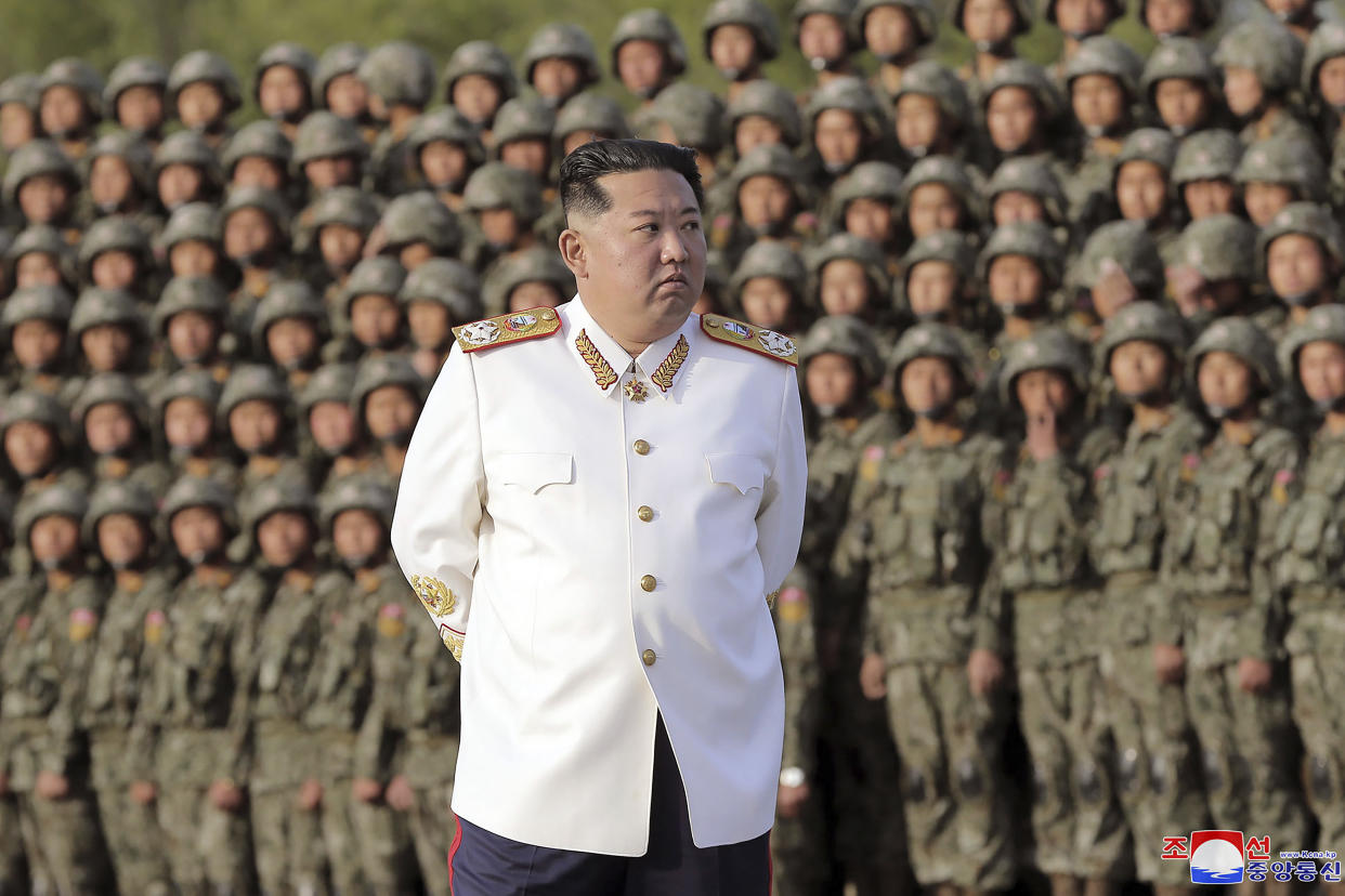 North Korean leader Kim Jong Un attends a photo session with the officers and soldiers who took part in a celebration the 90th founding anniversary of the Korean People's Revolutionary Army, in North Korea Wednesday, April 27, 2022. (Korean Central News Agency/Korea News Service via AP)