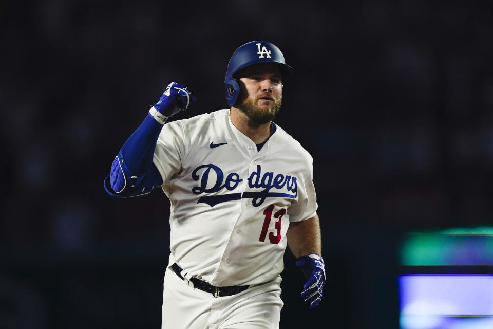 Los Angeles Dodgers designated hitter Max Muncy celebrates while running the bases after hitting a homer during the seventh inning of a baseball game against the Colorado Rockies, Thursday, Aug. 10, 2023, in Los Angeles. (AP Photo/Ryan Sun)