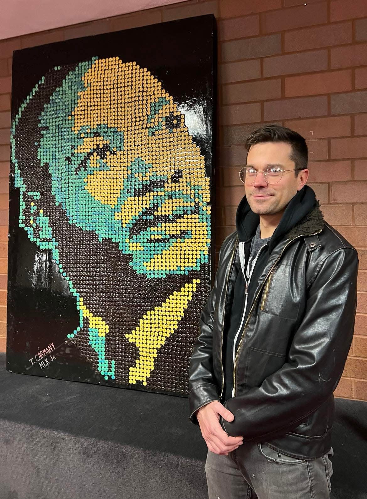 Canton artist Tim Carmany created this portrait of Martin Luther King Jr. using 1,000 old buttons that were dropped off at his art studio. ArtsinStark has donated the piece to McKinley High School.