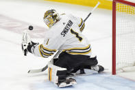 Boston Bruins goaltender Jeremy Swayman makes a save during the second period of Game 5 of the second-round series of the Stanley Cup Playoffs against the Florida Panthers, Tuesday, May 14, 2024, in Sunrise, Fla. (AP Photo/Wilfredo Lee)